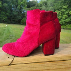 Red ankle boots.